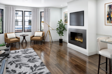 A living room with hardwood floors and fireplace.