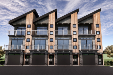 A row of four buildings with windows and balconies.