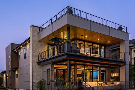 A large building with a balcony and a living room.