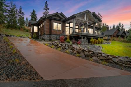 A house with a driveway and some rocks